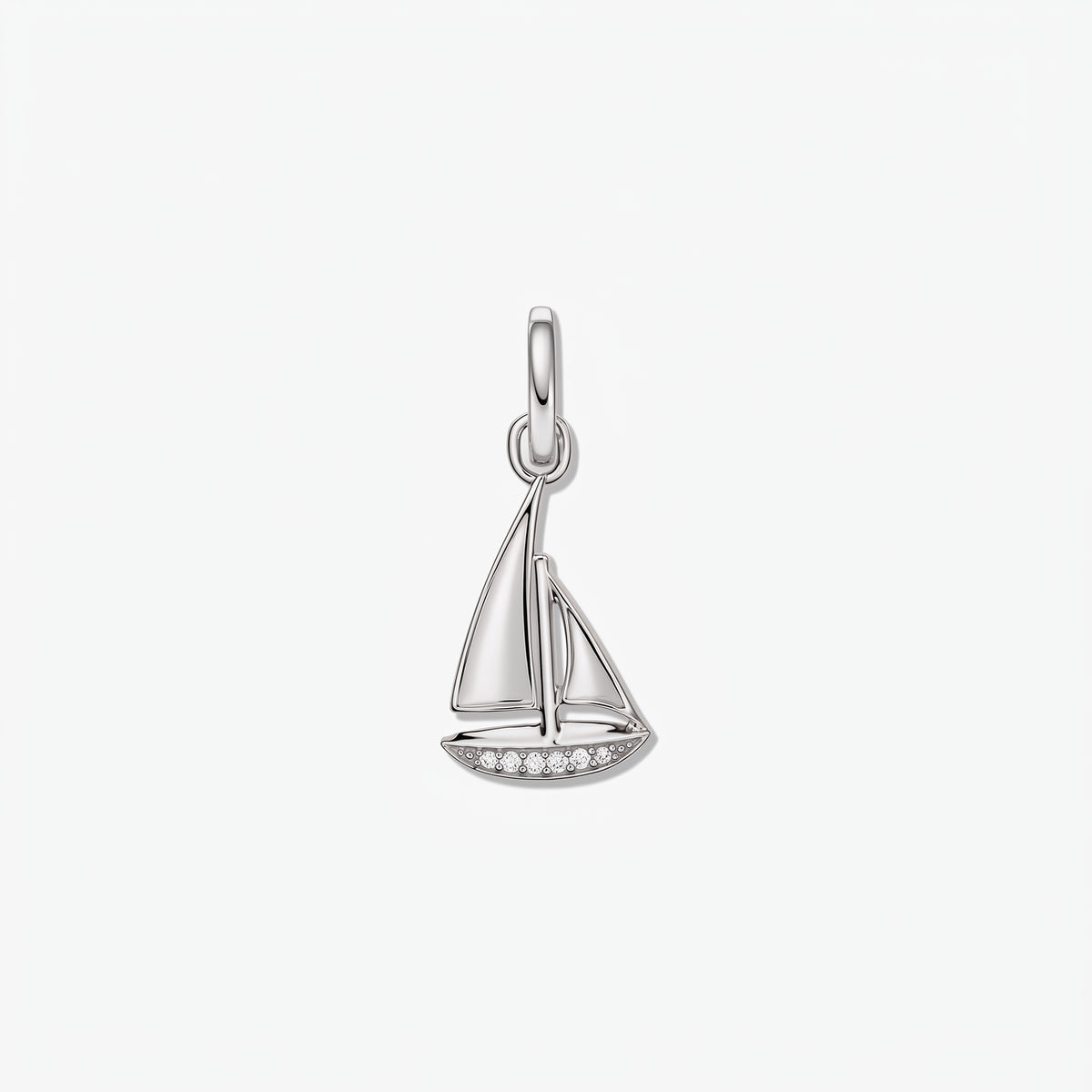 Sailboat-shaped 925 sterling silver pendant with white zirconia accents along the hull, isolated on a white background.