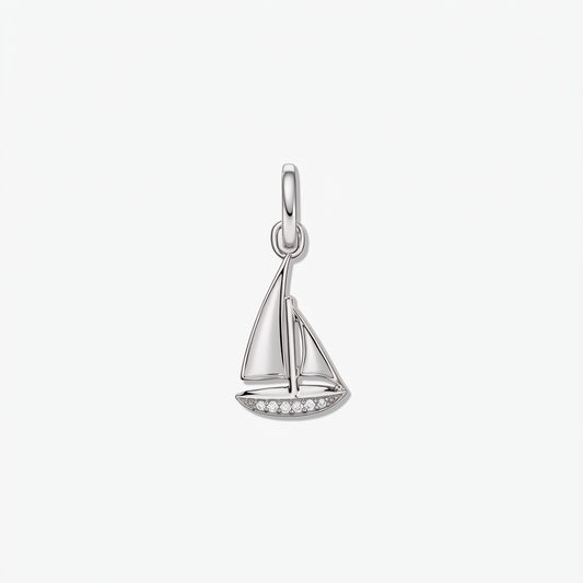 Sailboat-shaped 925 sterling silver pendant with white zirconia accents along the hull, isolated on a white background.
