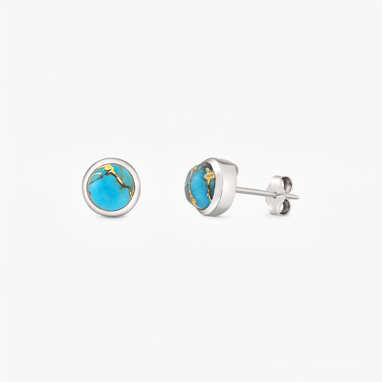 Pair of sterling silver stud earrings featuring round blue copper turquoise cabochons in bezel settings on a white background.