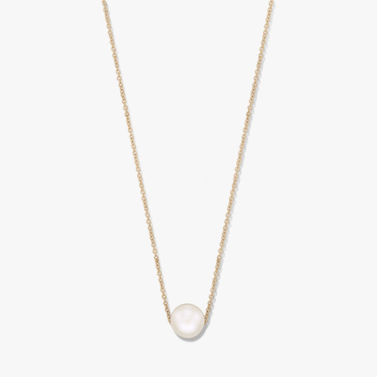 Delicate chain necklace with a single natural white pearl centered on a gold‑tone chain, isolated on a white background.
